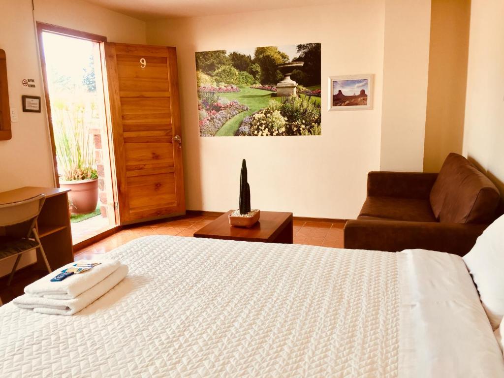 Postel nebo postele na pokoji v ubytování Quito Terrace