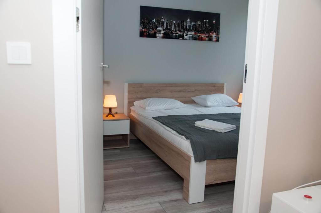 Posteľ alebo postele v izbe v ubytovaní Apartament Cybernetyki Mokotów