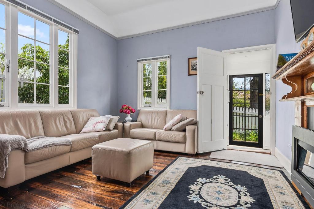 a living room with a couch and a fireplace at Gatehouse on Stoke in New Town