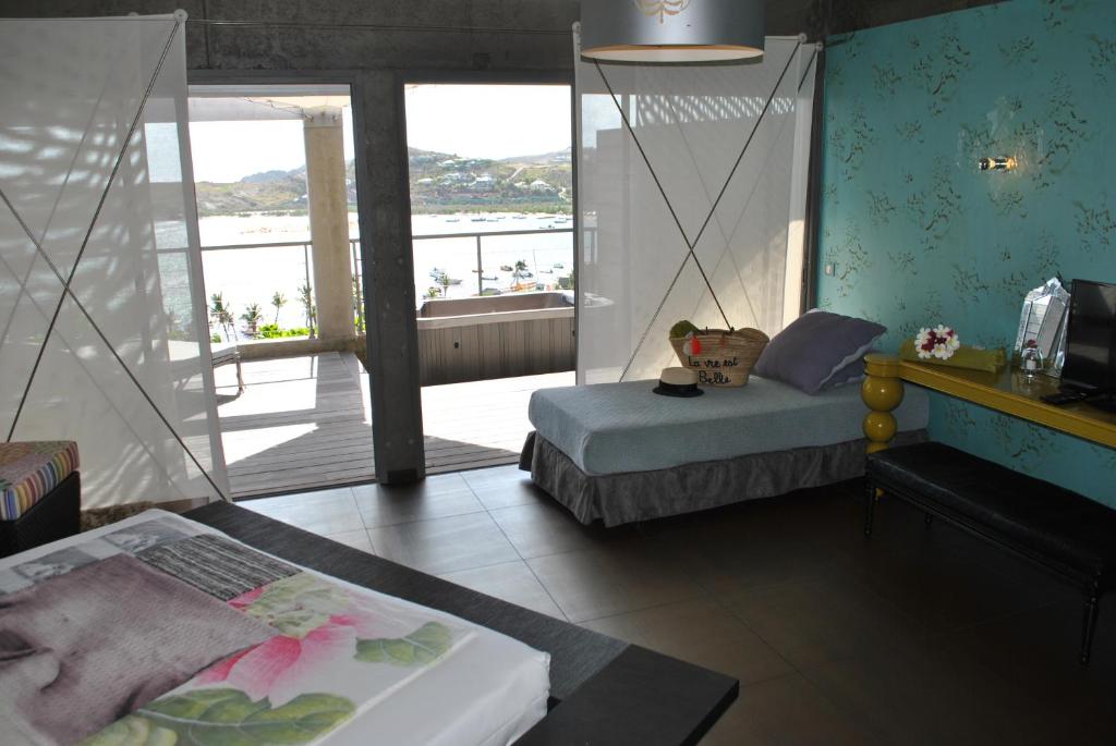 Postel nebo postele na pokoji v ubytování Villa Lodge 4 Epices