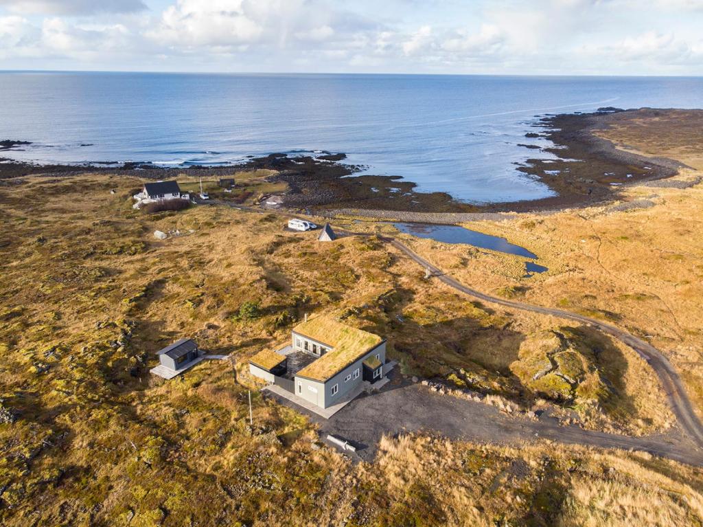 an aerial view of a house on the coast at Hvassahraun Cabin by the Sea in Vogar