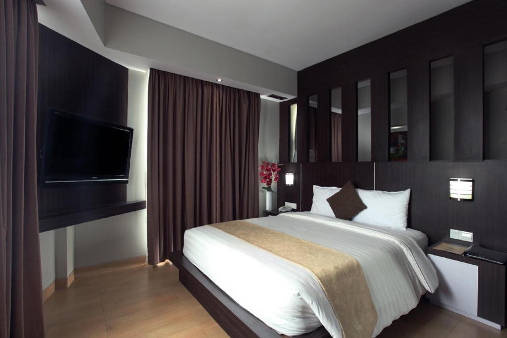 Postel nebo postele na pokoji v ubytování Grand Hatika Hotel
