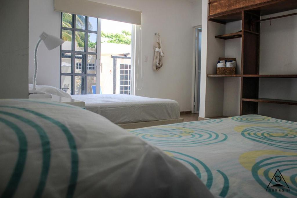 Postel nebo postele na pokoji v ubytování CASA KINICH SISAL