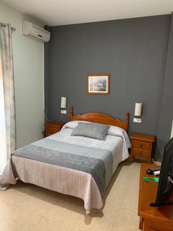 Posteľ alebo postele v izbe v ubytovaní Hotel-Restaurante la Loma