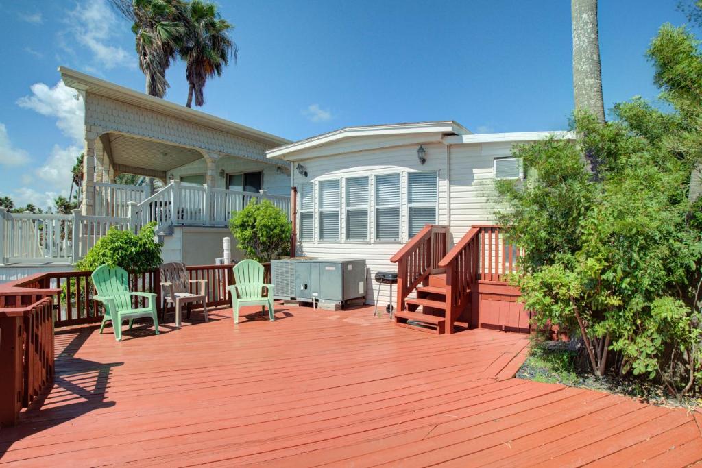 a deck in front of a house with chairs at Sand Dollar Dreams in South Padre Island