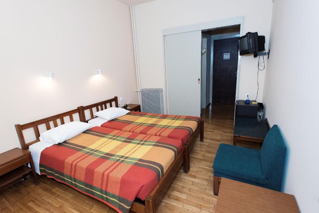 Postel nebo postele na pokoji v ubytování Hotel Alexandros