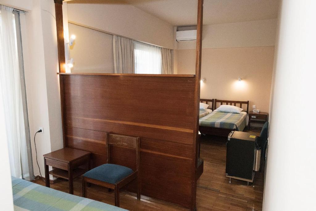 Postel nebo postele na pokoji v ubytování Hotel Alexandros