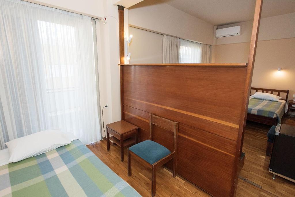 Postel nebo postele na pokoji v ubytování Hotel Alexandros