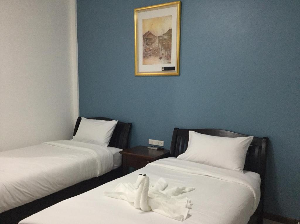 Postel nebo postele na pokoji v ubytování SABUN-NGA HOSTEL
