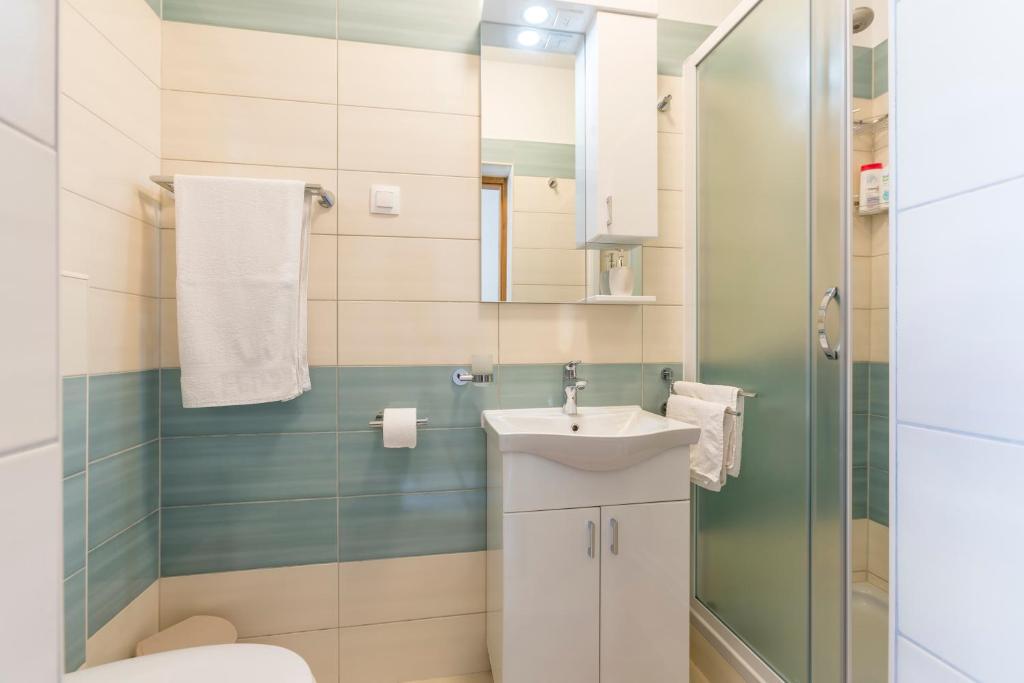 Koupelna v ubytování Apartmani Bezmalinović