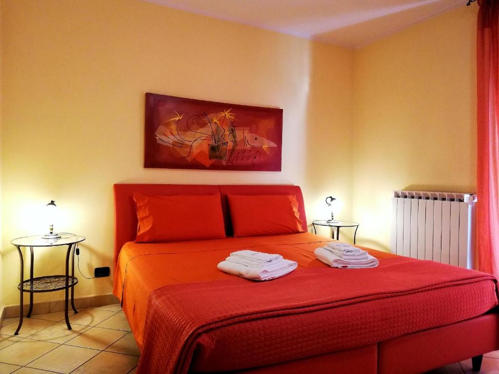Postel nebo postele na pokoji v ubytování B&B Domus Traiani Benevento