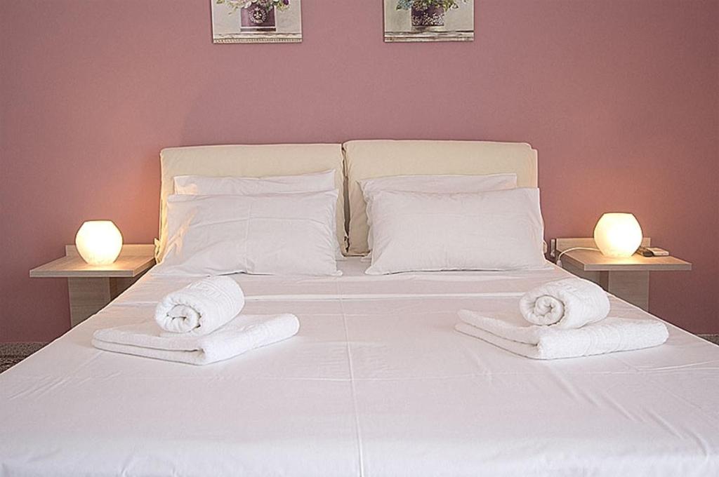 Postel nebo postele na pokoji v ubytování Galazia Nera Apartments