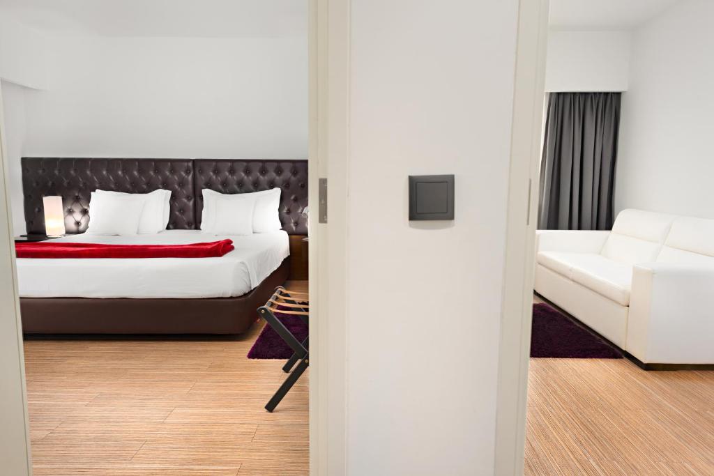 Postel nebo postele na pokoji v ubytování Hotel dos Zimbros