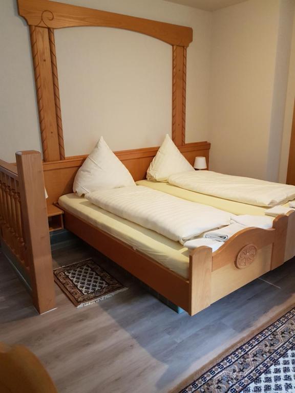 Postel nebo postele na pokoji v ubytování Hotel Restaurant Paelzer-Buwe