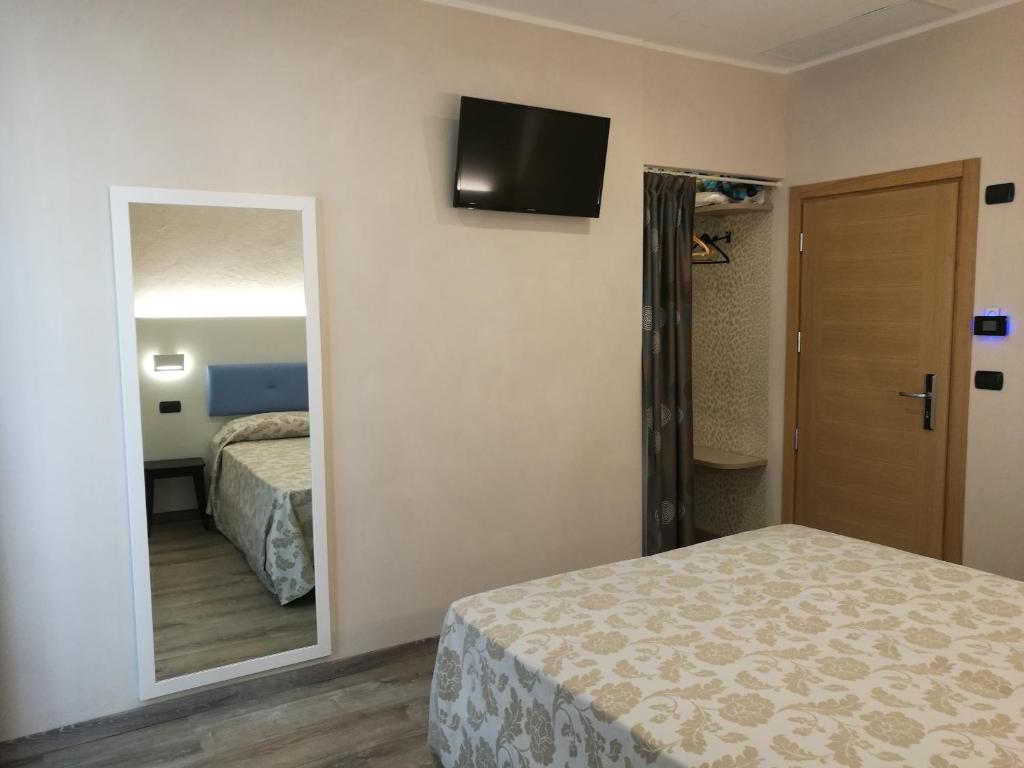 Postel nebo postele na pokoji v ubytování Hotel Rio Bellaria