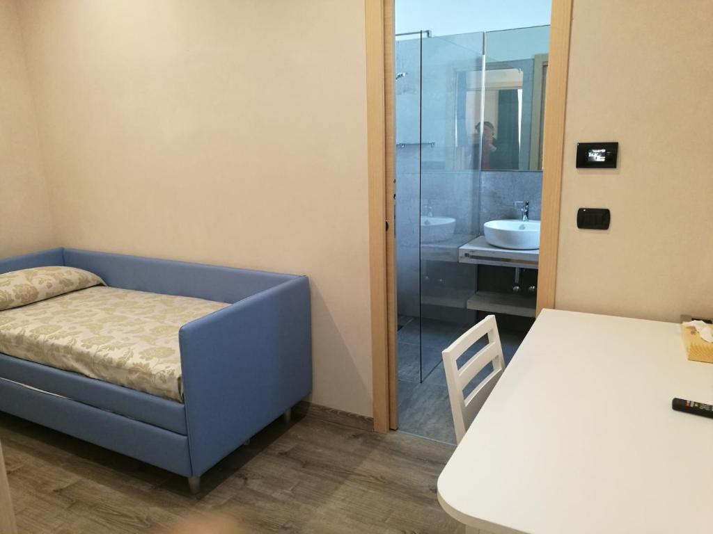 Postel nebo postele na pokoji v ubytování Hotel Rio Bellaria