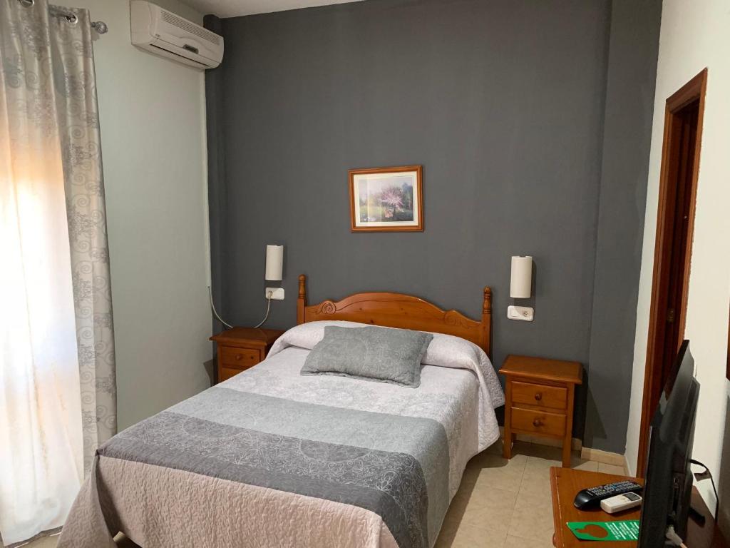 Posteľ alebo postele v izbe v ubytovaní Hotel-Restaurante la Loma