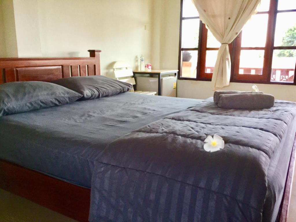 Postel nebo postele na pokoji v ubytování Thai Guesthouse