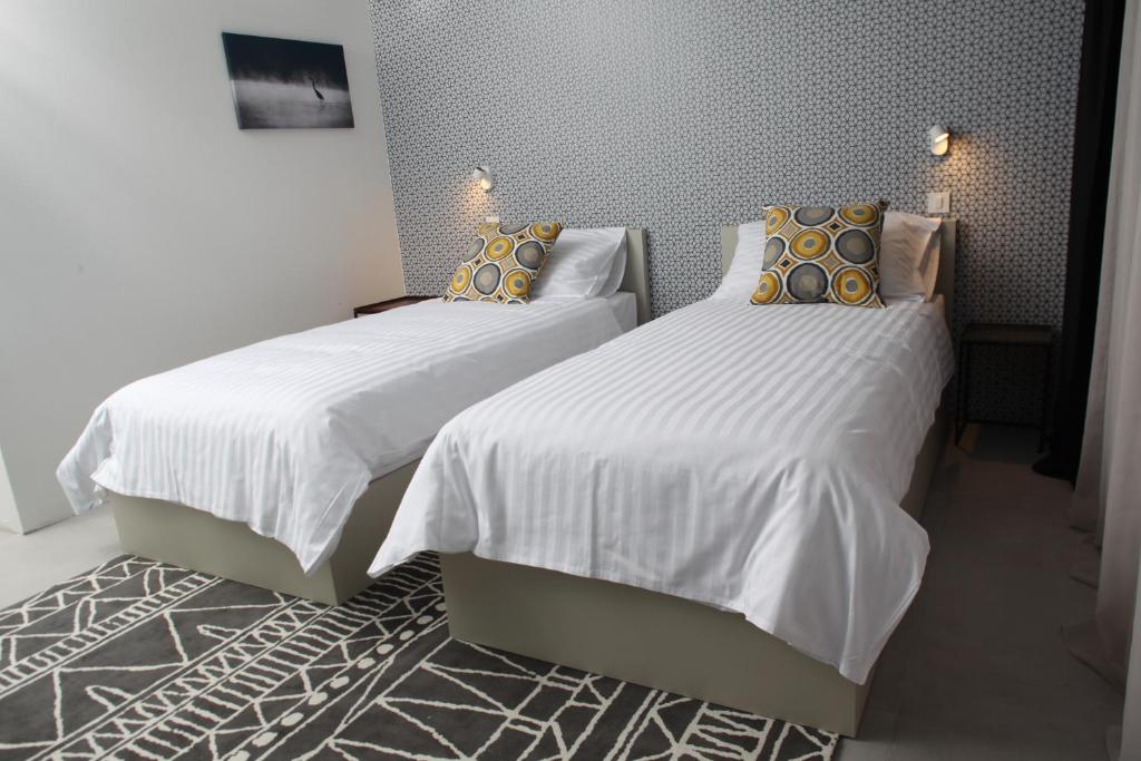 Postel nebo postele na pokoji v ubytování Hotel Cubis