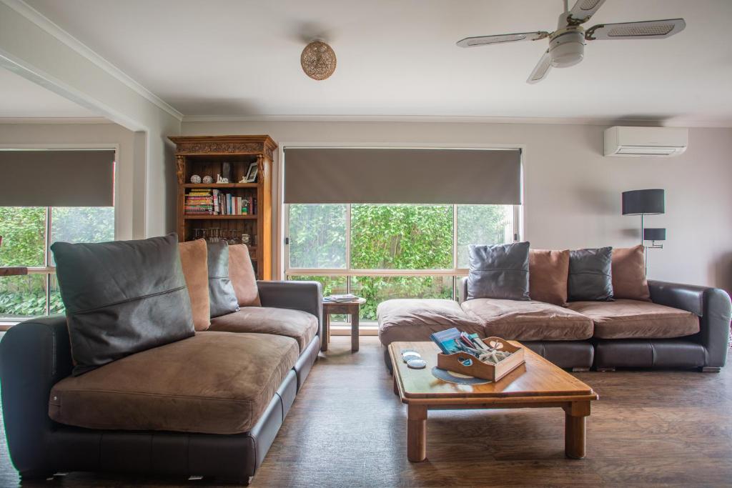 a living room with two couches and a coffee table at Mornington Peninsula-4Shore Rosebud in Rosebud