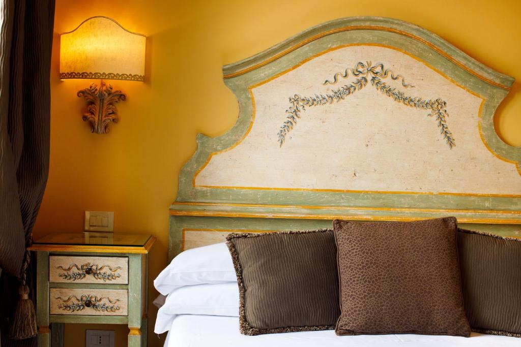 Postel nebo postele na pokoji v ubytování Hotel Palazzo Guardati