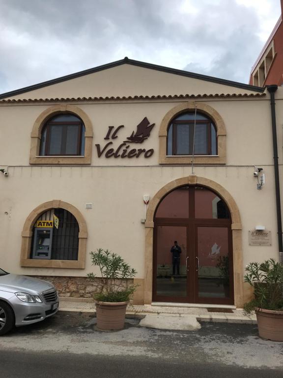 a building with a sign that reads la valerie at Il Veliero in Marzamemi