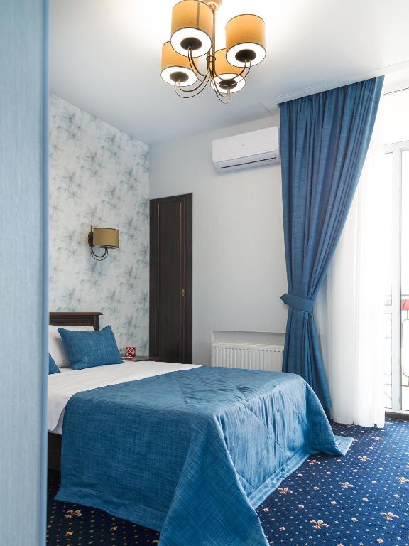 Postel nebo postele na pokoji v ubytování ArcadiaSky