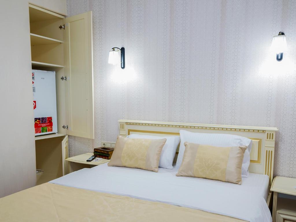 Postel nebo postele na pokoji v ubytování ArcadiaSky