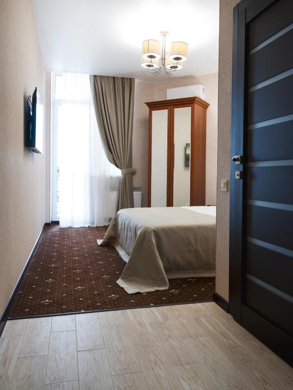 Postel nebo postele na pokoji v ubytování ArcadiaSky