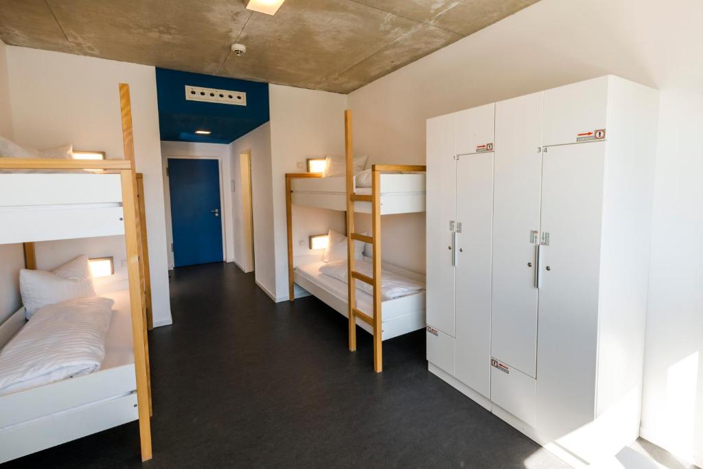 Postel nebo postele na pokoji v ubytování Jugendherberge Schweinfurt