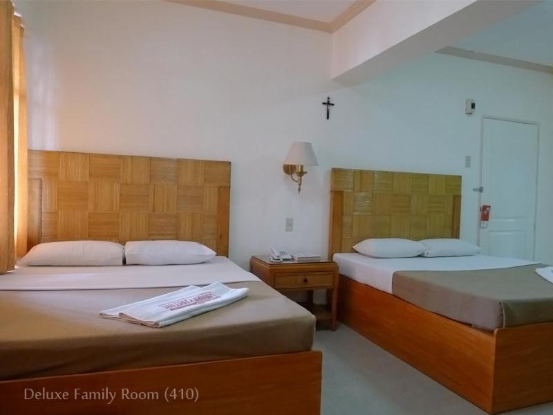 Postel nebo postele na pokoji v ubytování Cebuview Tourist Inn