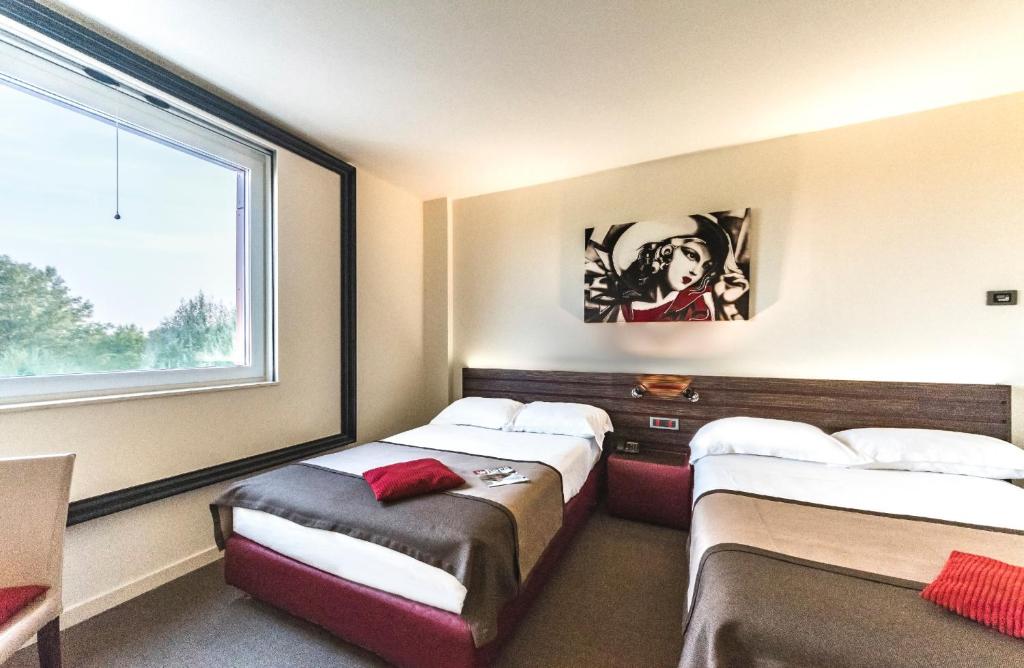 Postel nebo postele na pokoji v ubytování Antony Hotel - Venice Airport