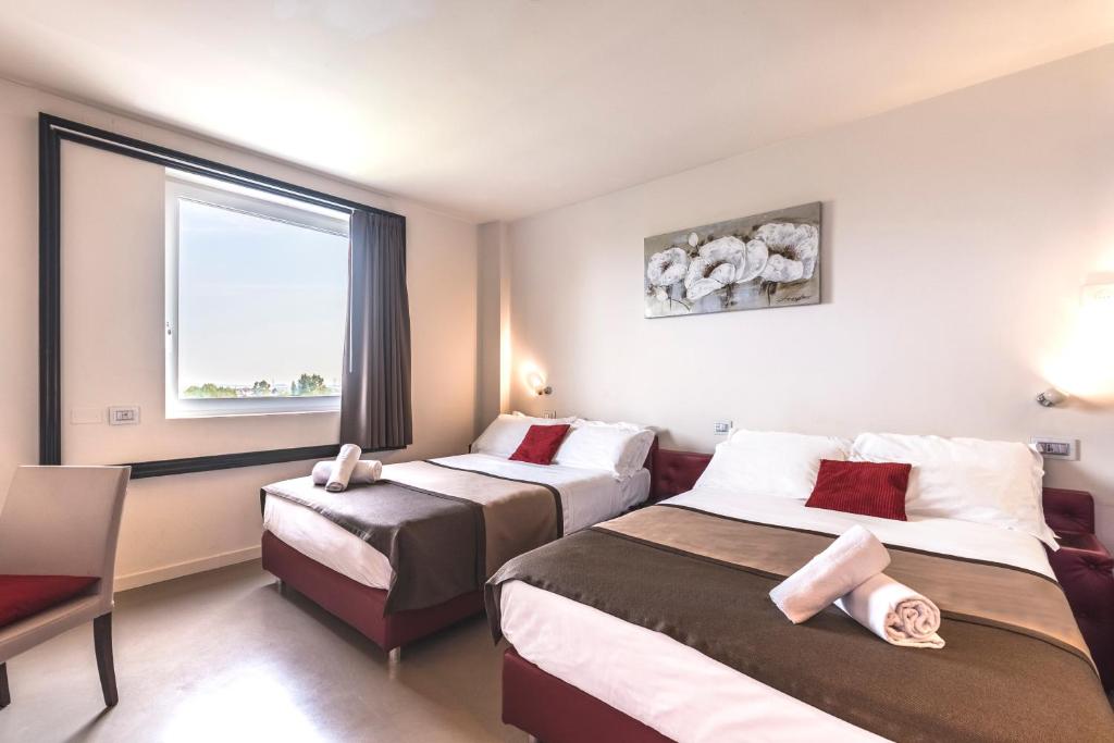 Postel nebo postele na pokoji v ubytování Antony Hotel - Venice Airport