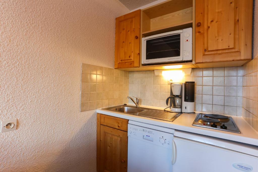 Kuchyň nebo kuchyňský kout v ubytování Vacancéole - Résidence Plein Sud