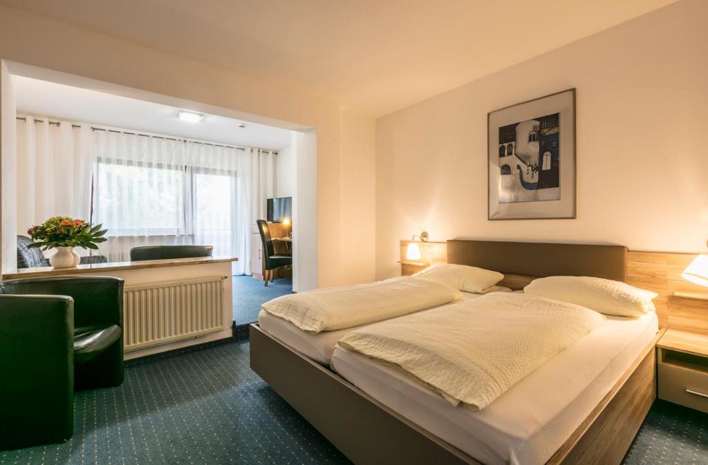 Postel nebo postele na pokoji v ubytování Hotel Bären