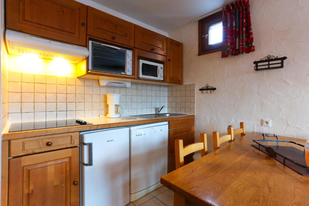 Kuchyň nebo kuchyňský kout v ubytování Vacancéole - Résidence Plein Sud