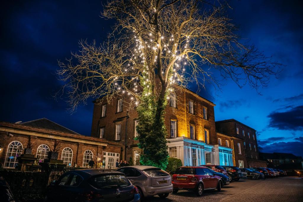 
a tree in the middle of a street at Bannatyne Hotel Darlington in Darlington
