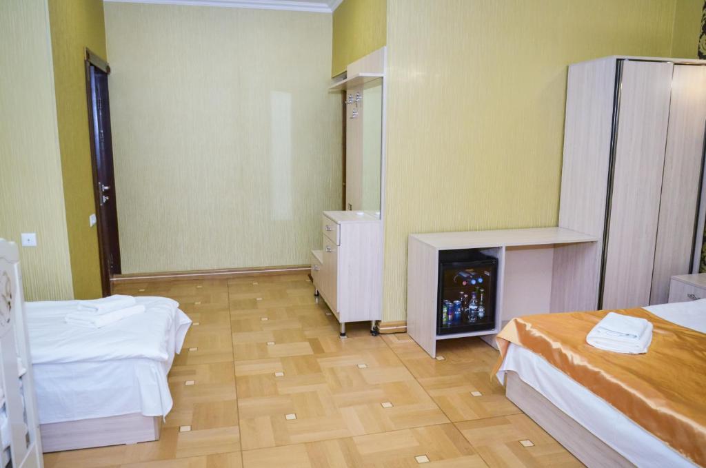 Postel nebo postele na pokoji v ubytování Rubin Hotel