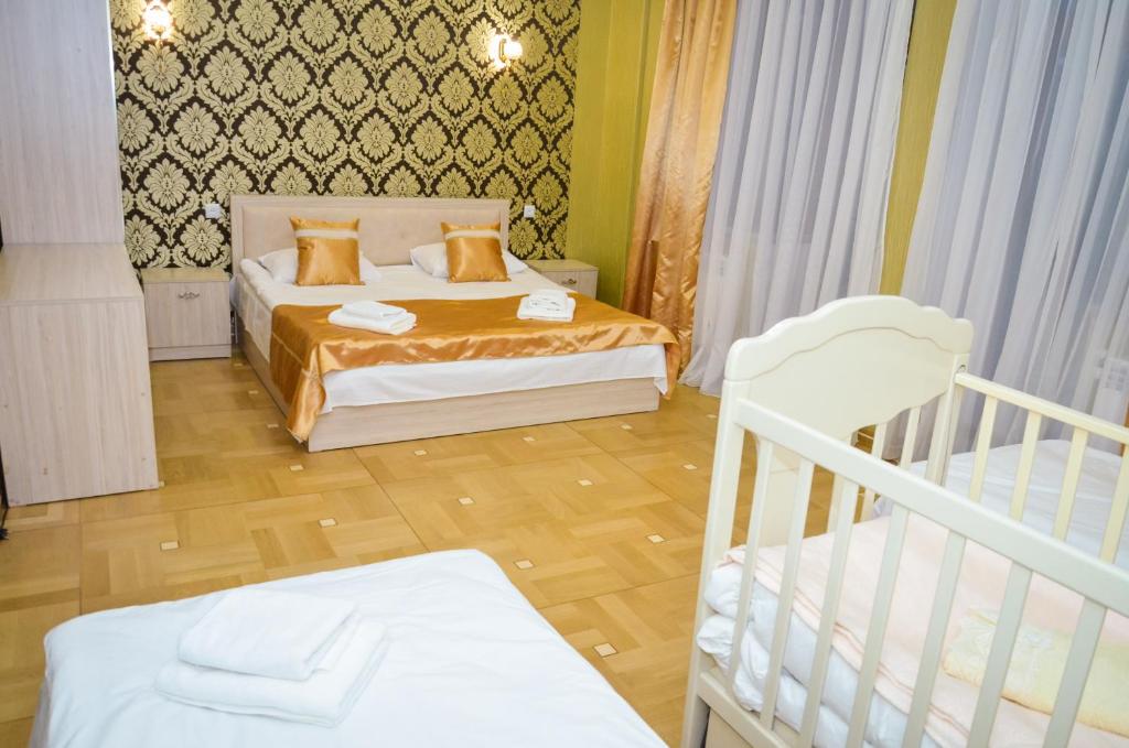 Postel nebo postele na pokoji v ubytování Rubin Hotel