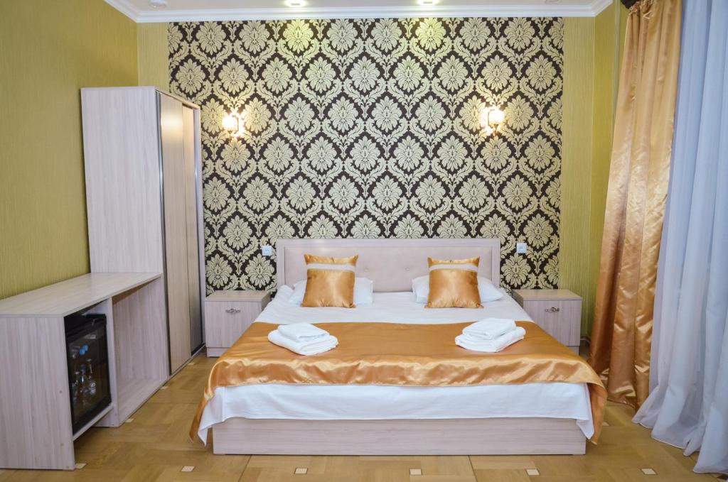 Postel nebo postele na pokoji v ubytování Rubin Hotel