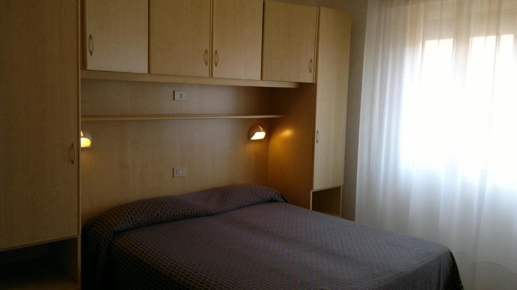 Postel nebo postele na pokoji v ubytování Hotel Erika