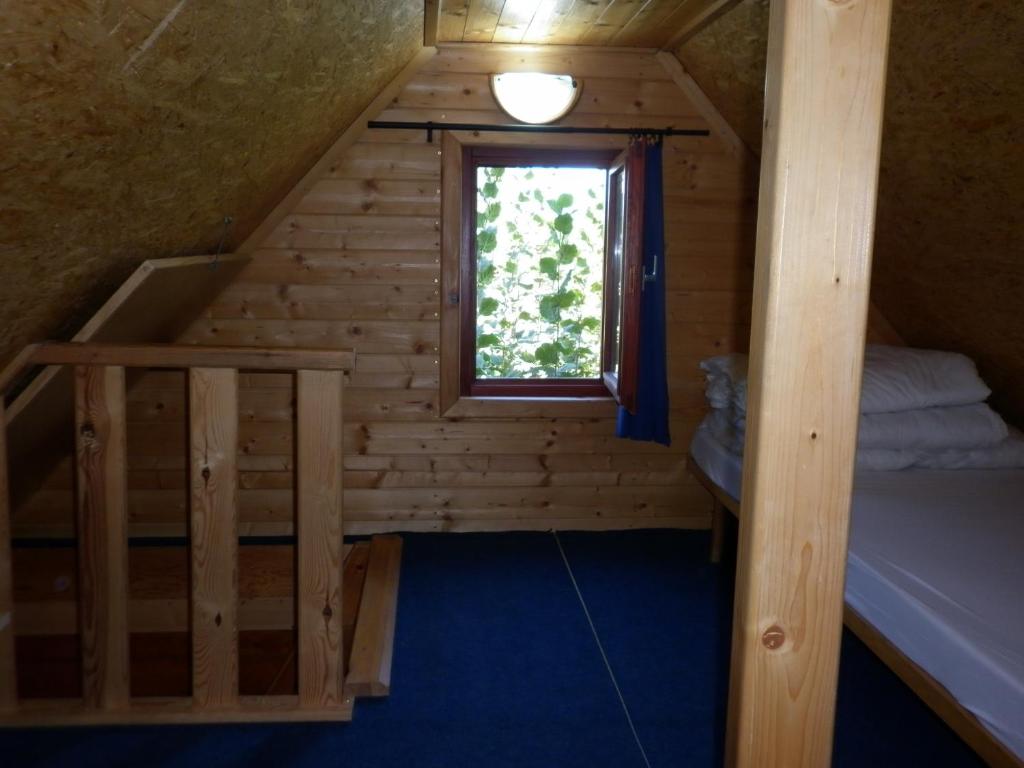 Postel nebo postele na pokoji v ubytování CHATA STRÁŽ