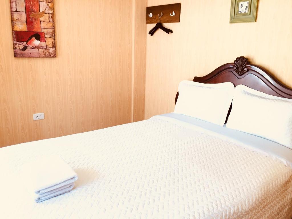 Postel nebo postele na pokoji v ubytování Quito Terrace