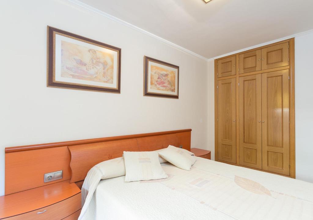 Posteľ alebo postele v izbe v ubytovaní Apartment Rambla Tarragona Free parking