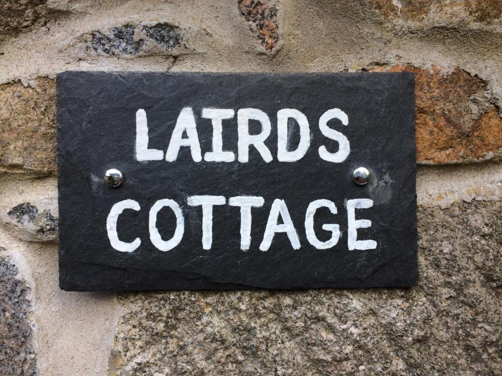 a sign on a wall that reads lalds coffee at LAIRDS COTTAGE in Stuartfield