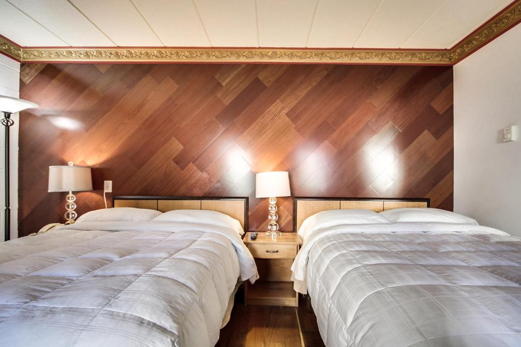 Postel nebo postele na pokoji v ubytování Motel Bellefeuille