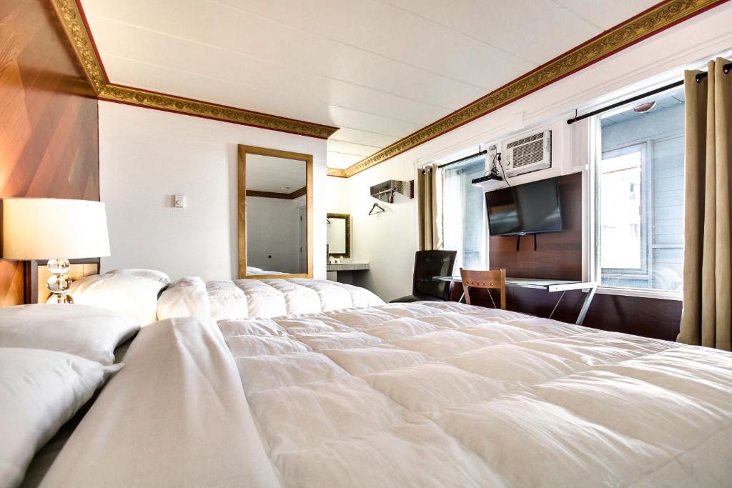 Postel nebo postele na pokoji v ubytování Motel Bellefeuille