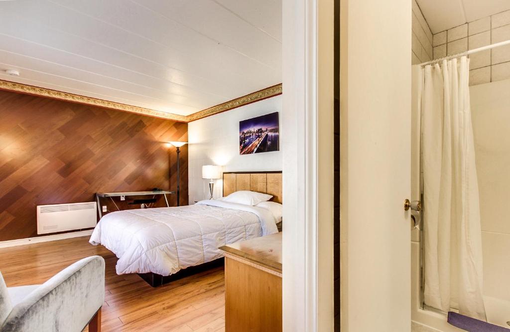 Postel nebo postele na pokoji v ubytování Motel Bellefeuille