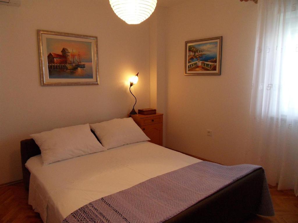 Posteľ alebo postele v izbe v ubytovaní Apartments Varos