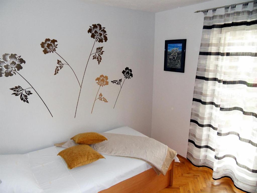 Posteľ alebo postele v izbe v ubytovaní Apartments Varos